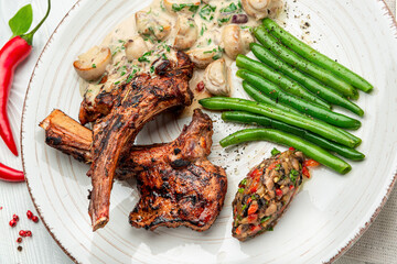 lamb rack barbecue served with side dishes