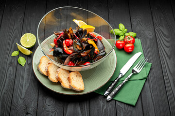 Boiled mussels in shells, various herbs, vegetables and spices