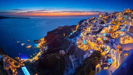 Deurstickers Oia town on Santorini island, Greece. Traditional and famous houses and churches with blue domes over the Caldera, Aegean sea © gatsi