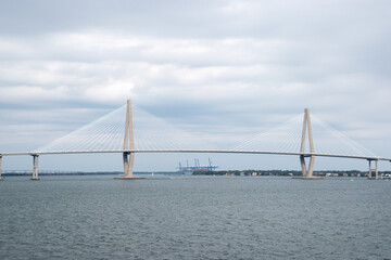 Fototapeta na wymiar The Ravenel Bridge during a cloudy day over the Cooper River in Charleston, South Carolina