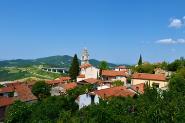 View of Crni Kal village with an old church of St. Valentin in Primorska, Slovenia and the viaduct