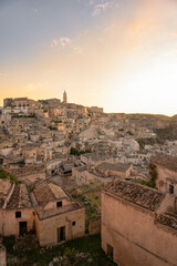 Fototapeta premium Stunning view of the village of Matera during a beautiful sunrise. Matera is a city on a rocky outcrop in the region of Basilicata, in southern Italy.