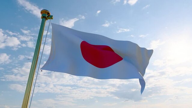 Flag of Japan waving in the wind, sky and sun background video. Japan flag video. Realistic Animation, 4K UHD 25 FPS. 3D Animation