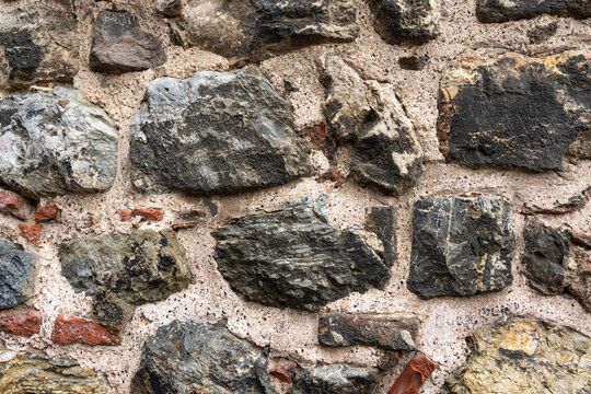 Ancient masonry. An old stone wall. Ancient texture. Close-up photos of high quality
