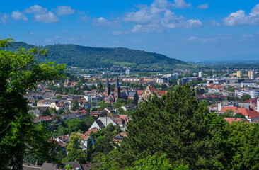 Fototapeta na wymiar Panorama of the city of Freiburg im Breisgau with church of St. John‘s Church in the foreground, Germany, Europe