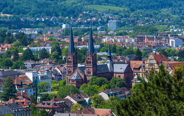 Fototapeta premium Panorama of the city of Freiburg im Breisgau with church of St. John‘s Church in the foreground, Germany, Europe