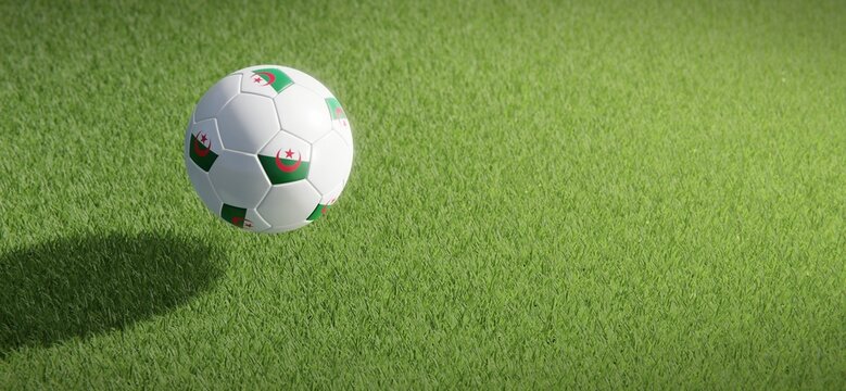 Football or soccer ball design with flag of Algeria against grass pitch backdrop. 3D rendering
