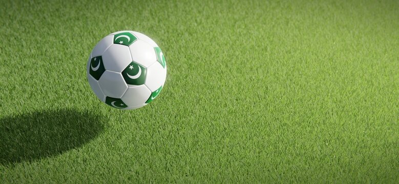 Football or soccer ball design with flag of Pakistan against grass pitch backdrop. 3D rendering
