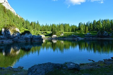 Obraz premium Double lake or Dvojno jezero in Triglav lakes valley in Julian alps and Triglav national park in Slovenia with a reflection on the water