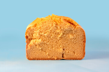 Corn bread. Homemade cornmeal bread on a blue background .Top view - obrazy, fototapety, plakaty