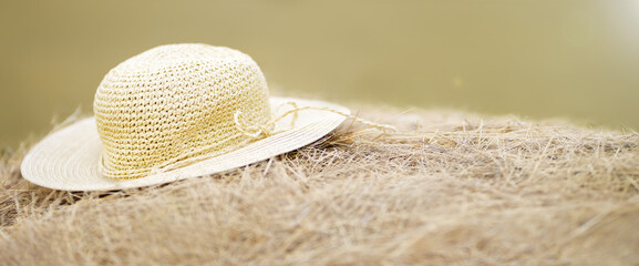 The straw hat lying on a haystack.  Summer headdress. Banner