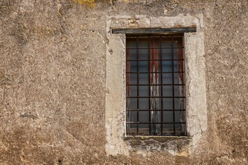 Close up of an old window on the ruins of a villa in Italy with copy space.