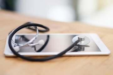 Its important to log your medical history with your practitioner. Cropped shot of a stethoscope on a tablet.