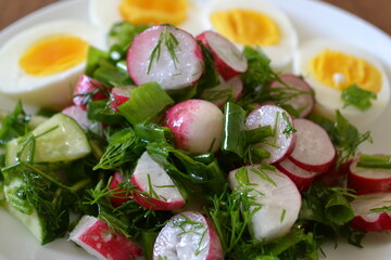 Salad of radish and herbs with egg.