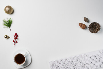 White Christmas, desk office with laptop, decoration and work supplies with cup of coffee. Top view with copy space for input the text. Flat lay desk table winter Christmas. Business Holidays Concept.