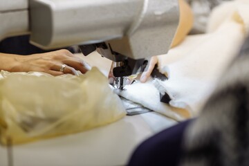 sewing machine scribbling fabric. tailoring at the factory