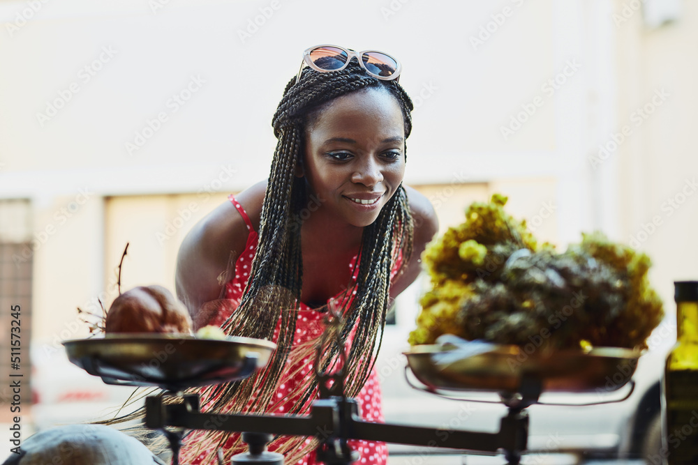 Aufkleber maybe i should go have a look inside. shot of a woman peering through a shops window while out on a 