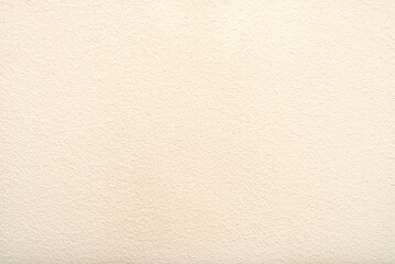 Light orange painted plaster wall texture. Background wall texture with copy space for the text.

