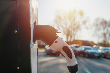 Close up power cord for electric car. Green station.Power supply for electric car battery...