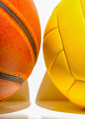 basketball and volleyball ball on a white background isolated. yellow and orange balls in large fragments with leather texture and empty space for inscriptions and texts