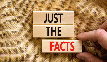 Just the facts symbol. Concept words Just the facts on wooden blocks on a beautiful canvas table...