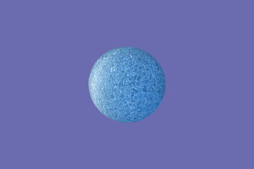 Nice blue cork ball like a blue planet isolated on a purple,veri peri trendy 2022 years color background.Copy space.exoplanet,HD 189733b,blue planet.