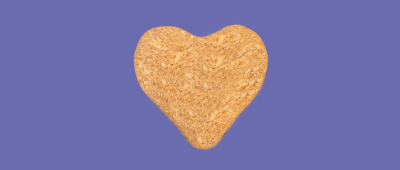 Banner.Nice brown cork heart shape isolated on the veri peri purple background,close up,selective focus.Advertisement.Copy space.