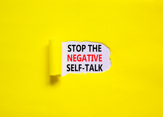 Stop negative self-talk symbol. Concept words Stop the negative self-talk on a beautiful yellow background. Psychological and stop negative self-talk concept. Copy space.