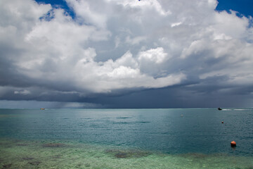 Rain clouds over the Pacific Ocean near Papeete Island. Raining clouds over sea nature environment concept.