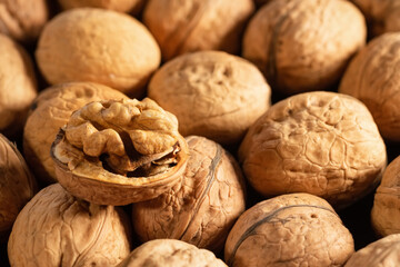 Walnut kernels and whole walnuts on the market. Healthy food.