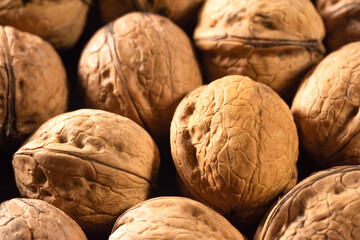 Walnuts in the shell on the table close-up