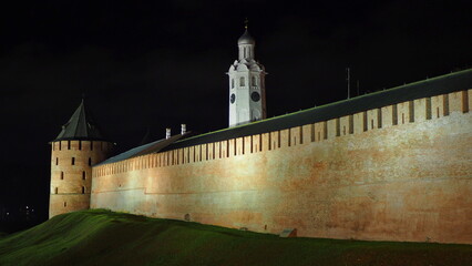 Historical monument. The walls and towers are made of red brick. Night photo of the Novgorod Kremlin "Detinets". Veliky Novgorod, Russia.