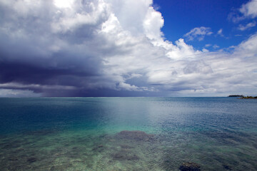 Rain clouds over the Pacific Ocean near Papeete Island. Raining clouds over sea nature environment concept.