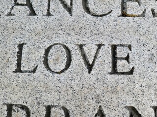the word love engraved or etched on marble