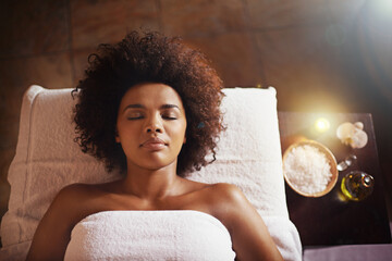 Indulging in some relaxing down time. Cropped shot of a beautiful young woman relaxing during a spa treatment.