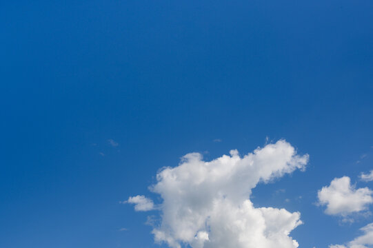 white clouds in a bright blue sky