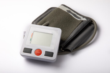 Digital blood pressure monitor isolated on white. Medical equipment blood pressure monitor. Healthcare. Place for text. Medicine concept. The concept of cardiology.