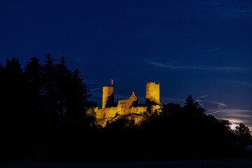 Obraz premium Image of illuminated Muenzenberg castle ruin in Germany in the evening