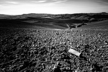 plowed fields in Italy region in Tuscany. Autumn in October. The landscape is characterized by its...