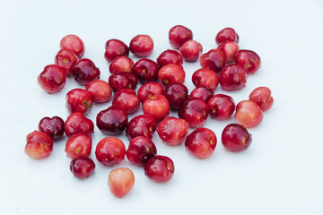 Red cherries isolated on a white background. Juicy red cherries berries with water drops. Organic berries for jam, juice, smoothie, compote, desserts and cakes.