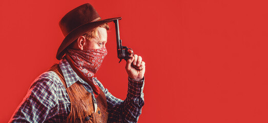 Portrait of cowboy in hat. Portrait of man wearing cowboy hat, gun. Portrait of a cowboy. West, guns