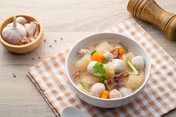 Thai Clear Soup with minced pork ,fish meatballs ,sheet of dried pig skin ,carrot and dried squid