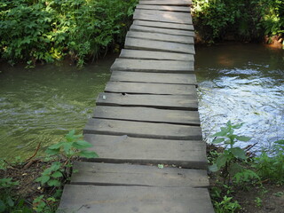 A small wooden bridge across a river