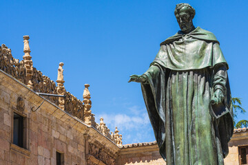 Courtyard of the minor schools of the University of the city of Salamanca and statue of Fray Luis de Leon, in Spain.