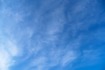 bright blue sky with clouds as abstract background
