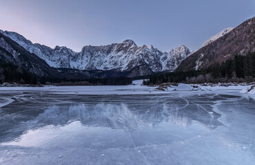 Reflections in the frozen lake at night