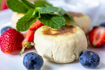 Homemade cheesecake with fresh strawberries and blueberries dessert - healthy organic summer dessert pie cheesecake. Vanilla Cheese Cake