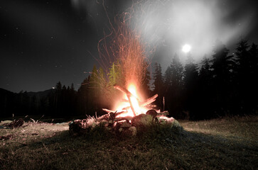 fire in the woods, bonfire full moon, smoke camping walking hiking trails, 
