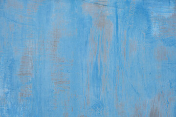 Fototapeta na wymiar Background is sheet of metal painted with old peeling blue paint.