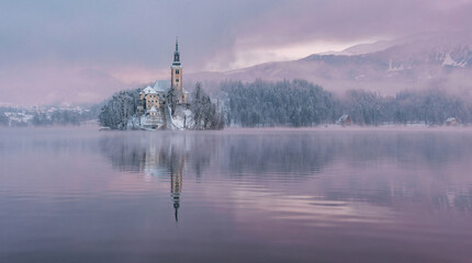 Lake Bled with the church and the castle on a calm winter morning